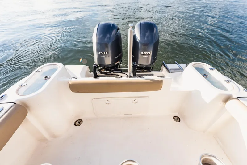 Slide: The Image of Key West 244 Center Console boat with twin outboard engines. - 18