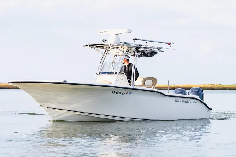 Slide: The Image of 2018 Key West 244 Center Console boat on calm water. - 2