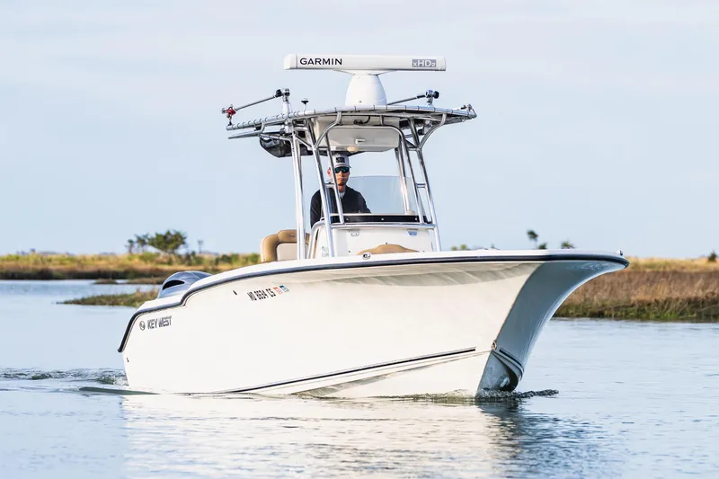 Slide: The Image of 2018 Key West 244 Center Console boat on calm water. - 3