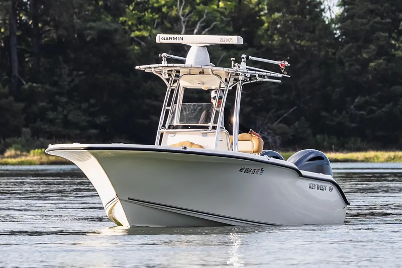 Slide: The Image of 2018 Key West 244 Center Console boat on calm water. - 4