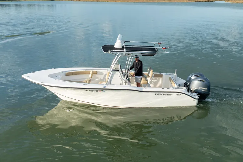 Slide: The Image of 2018 Key West 244 Center Console boat on calm water. - 7