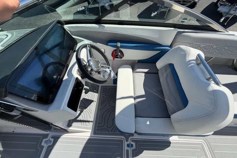 Slide: The Image of 2026 Regal LS6 Surf boat interior with modern steering and seating design. - 10