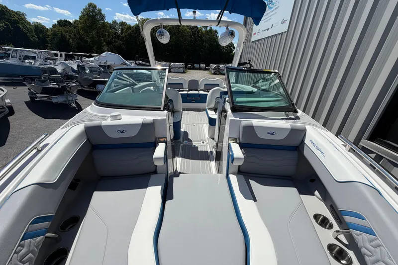 Slide: The Image of 2026 Regal LS6 Surf boat interior with sleek seating and modern design. - 11