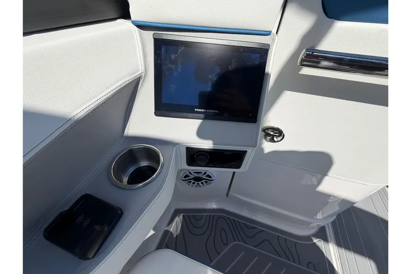 Slide: The Image of 2026 Regal LS6 Surf boat interior with touchscreen, cup holder, and sleek design. - 4