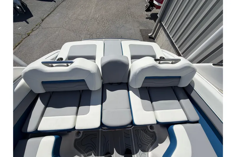Slide: The Image of 2026 Regal LS6 Surf boat interior with luxurious white and gray seating. - 8