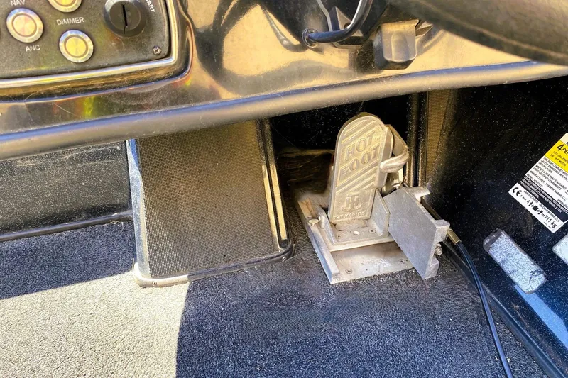 Slide: The Image of Foot pedal and control panel inside a 2017 Nitro Z19 boat cockpit. - 10