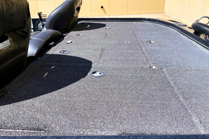 Slide: The Image of 2017 Nitro Z19 boat deck with seating and carpeted surface. - 13