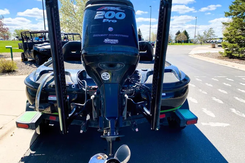 Slide: The Image of 2017 Nitro Z19 boat with a powerful 200 Pro outboard motor, parked on a sunny day. - 15