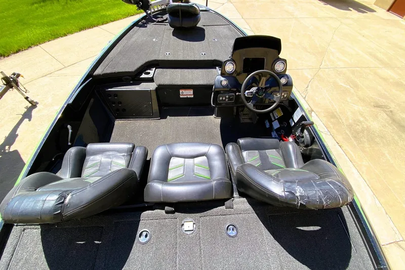 Slide: The Image of 2017 Nitro Z19 boat interior with black leather seats and steering console. - 7