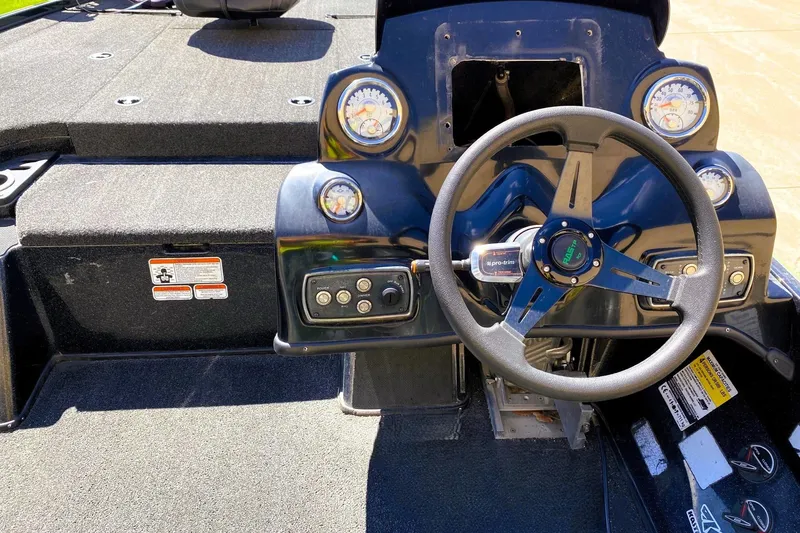 Slide: The Image of Steering console of a 2017 Nitro Z19 boat with gauges and controls. - 8