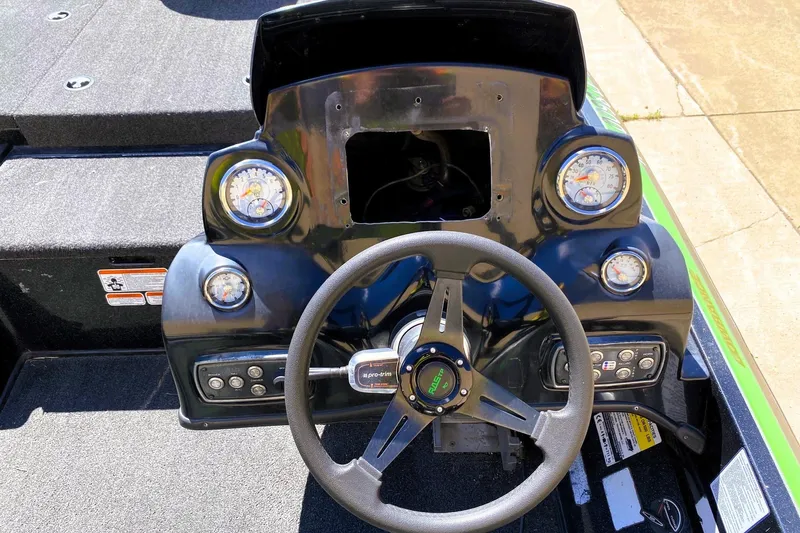Slide: The Image of Steering console of a 2017 Nitro Z19 boat with gauges and controls. - 9