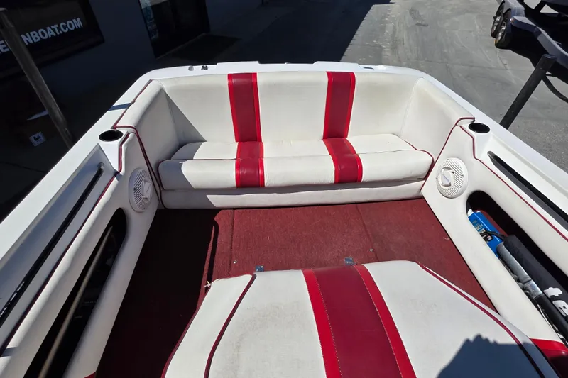 Slide: The Image of 1987 MasterCraft ProStar 190 interior with red and white seating and carpet. - 5