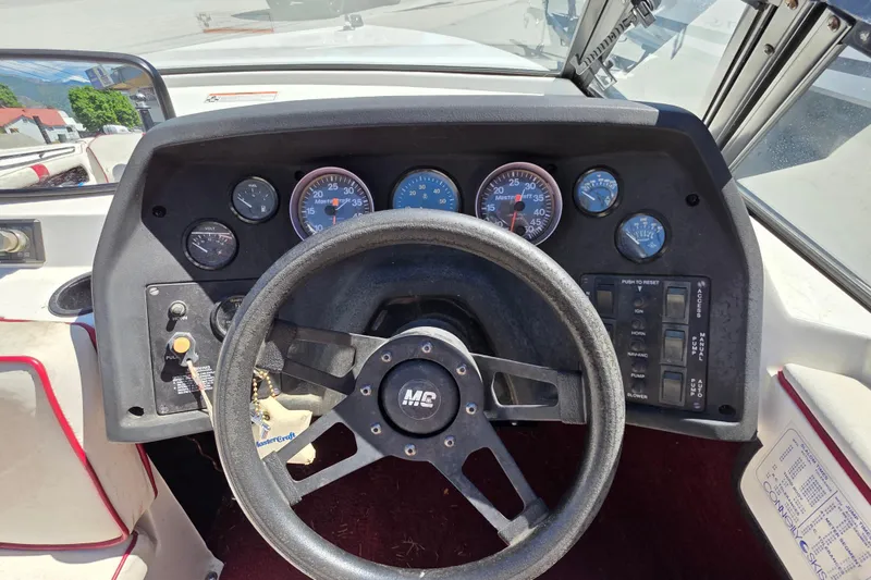 Slide: The Image of 1987 MasterCraft ProStar 190 dashboard with steering wheel and instrument gauges. - 7