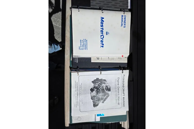 Slide: The Image of 1987 MasterCraft ProStar 190 owner's manuals displayed on a table. - 9