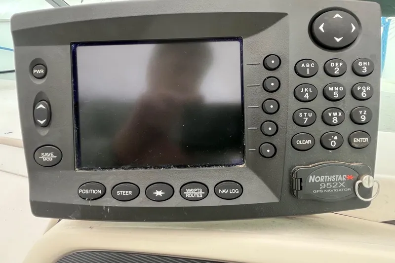Slide: The Image of Northstar 952X GPS navigator on 1994 Sea Ray 310 Amberjack boat dashboard. - 13