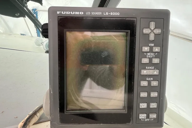 Slide: The Image of Furuno LCD sounder LS-6000 on 1994 Sea Ray 310 Amberjack boat dashboard. - 14