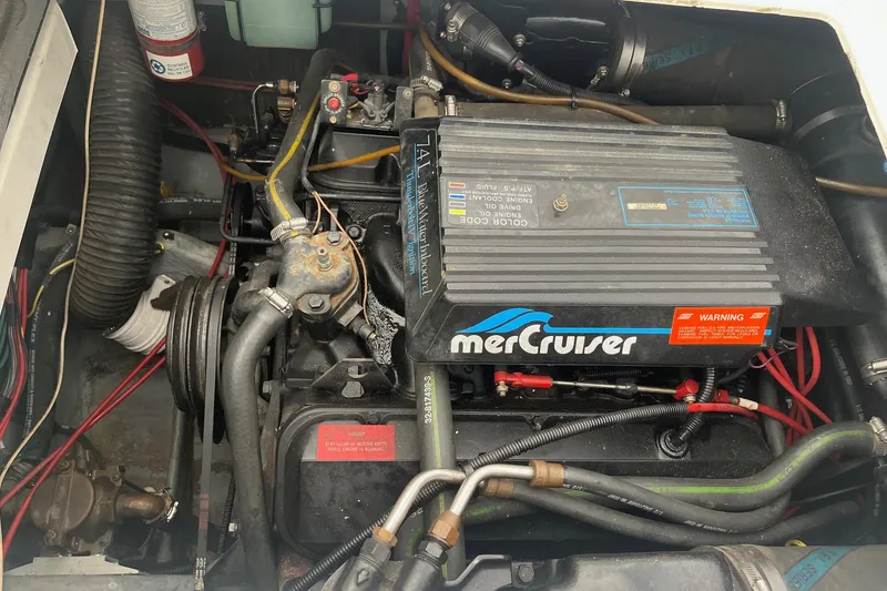 Slide: The Image of Engine compartment of a 1994 Sea Ray 310 Amberjack with MerCruiser engine. - 32