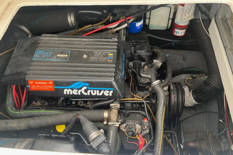 Slide: The Image of Engine compartment of a 1994 Sea Ray 310 Amberjack with MerCruiser components. - 33