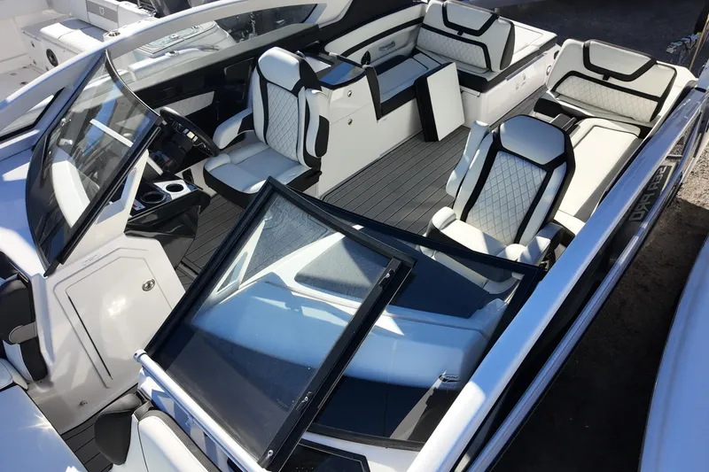 Slide: The Image of 2024 Yamaha Boats 275SE interior with luxurious seating and modern design. - 10