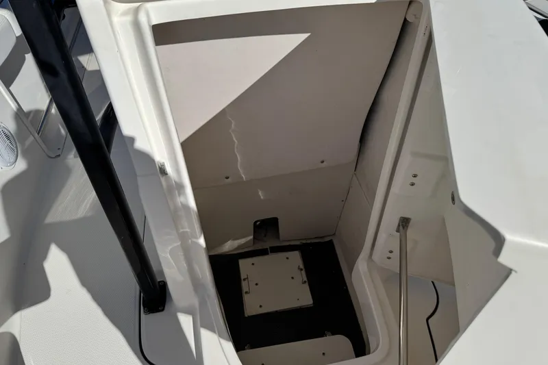 Slide: The Image of 2021 Robalo R222 Center Console boat storage compartment interior. - 14