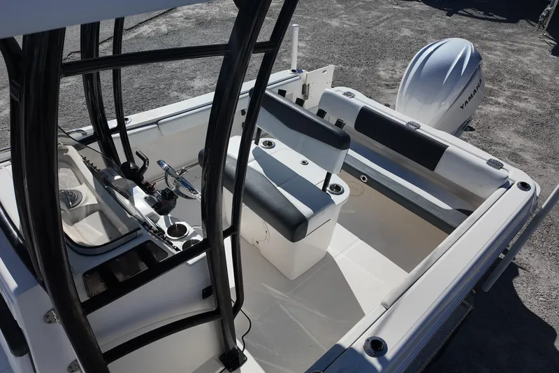 Slide: The Image of 2021 Robalo R222 Center Console boat interior with Yamaha engine, featuring seating and steering console. - 16