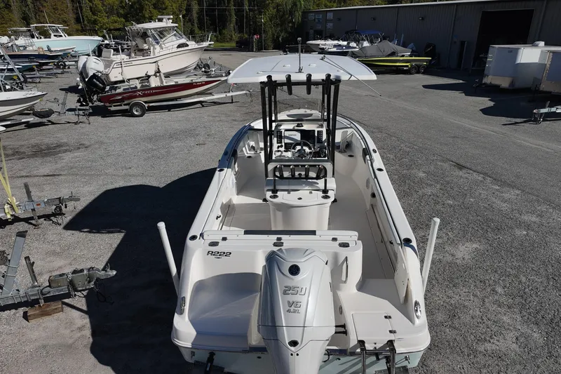 Slide: The Image of 2021 Robalo R222 Center Console boat in a marina storage area. - 18