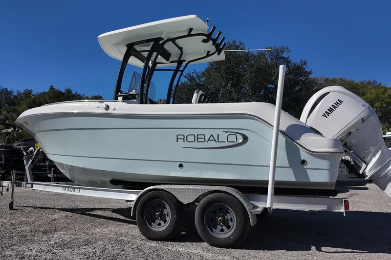 Slide: The Image of 2021 Robalo R222 Center Console boat on trailer with Yamaha engine. - 3