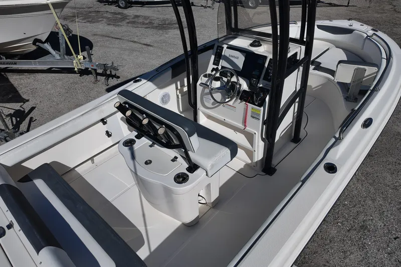 Slide: The Image of 2021 Robalo R222 Center Console boat interior with steering wheel and seating. - 6