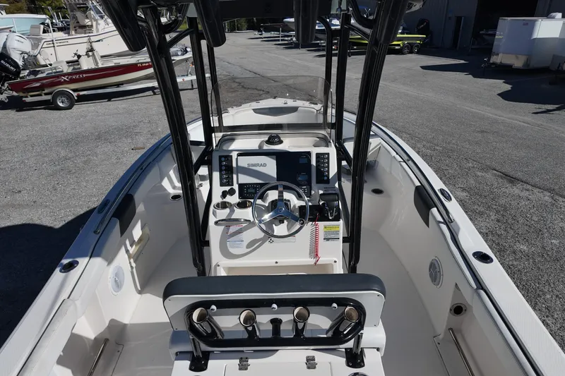Slide: The Image of 2021 Robalo R222 Center Console boat interior with steering wheel and controls. - 7