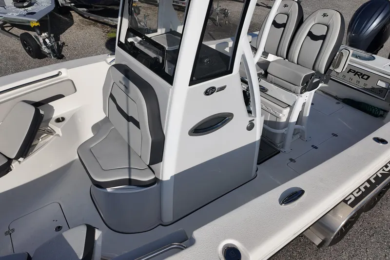 Slide: The Image of 2025 Sea Pro 262 Offshore boat interior with seating and console details. - 15