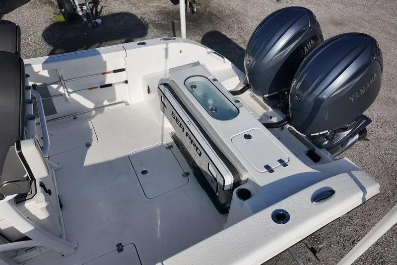 Slide: The Image of 2025 Sea Pro 262 Offshore boat deck with dual Yamaha engines. - 18