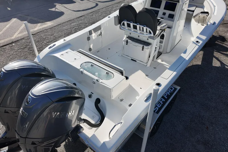 Slide: The Image of 2025 Sea Pro 262 Offshore boat with dual Yamaha engines, spacious deck, and modern console. - 7