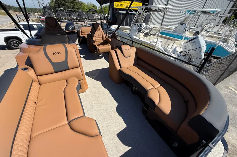 Slide: The Image of Luxurious interior of 2026 Avalon Catalina Quad Lounge boat with tan seating and modern design. - 10