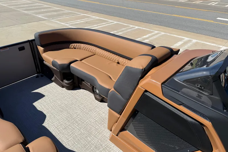 Slide: The Image of Luxurious seating on 2026 Avalon Catalina Quad Lounge boat, featuring elegant brown upholstery. - 13