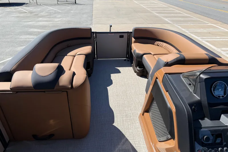 Slide: The Image of 2026 Avalon Catalina Quad Lounge boat interior with luxurious seating and modern dashboard. - 14