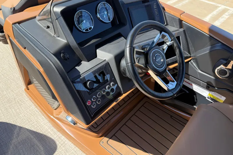 Slide: The Image of 2026 Avalon Catalina Quad Lounge dashboard with steering wheel and control panel. - 18
