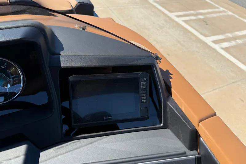 Slide: The Image of Dashboard of 2026 Avalon Catalina Quad Lounge boat with Garmin display and speedometer. - 19