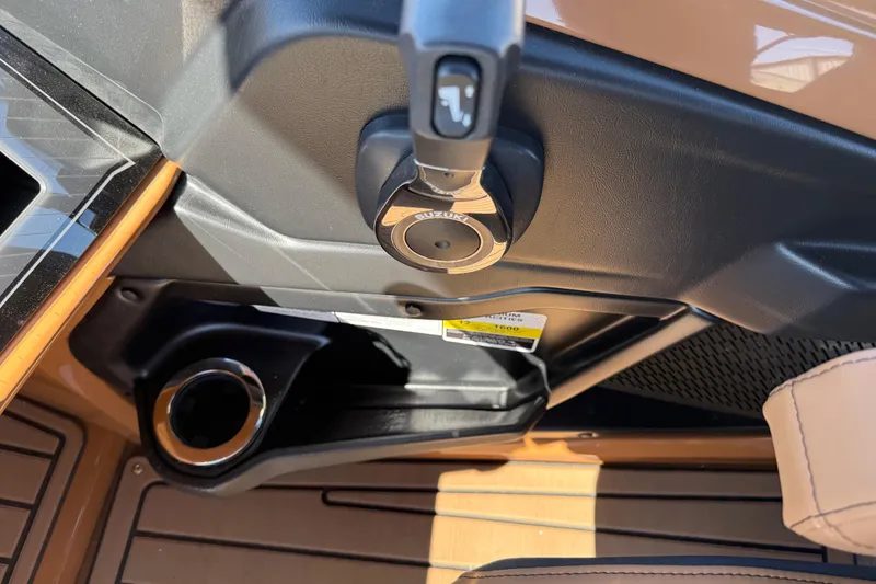 Slide: The Image of Interior of 2026 Avalon Catalina Quad Lounge boat, featuring ignition and cup holder. - 21