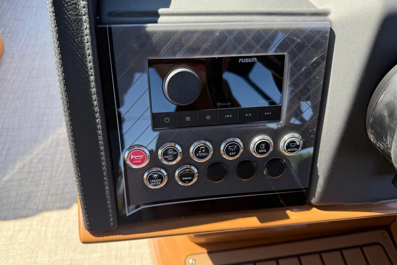 Slide: The Image of Control panel of 2026 Avalon Catalina Quad Lounge boat with buttons and display. - 24
