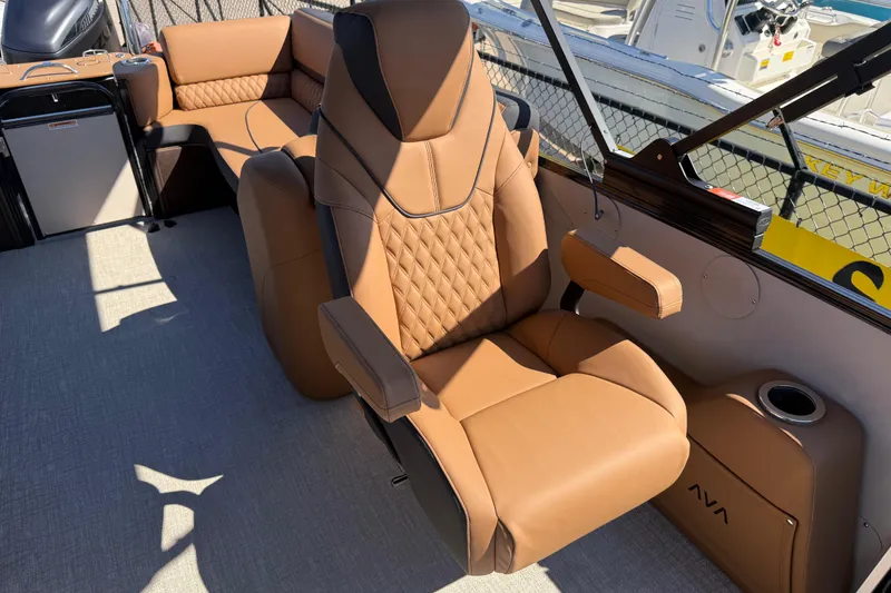 Slide: The Image of Luxurious seating on 2026 Avalon Catalina Quad Lounge boat, featuring tan leather upholstery. - 26