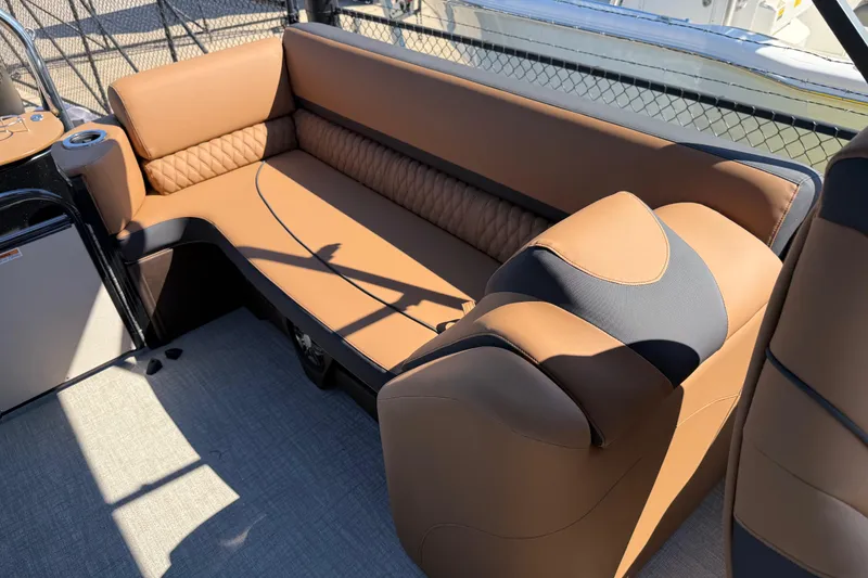 Slide: The Image of Luxurious seating on 2026 Avalon Catalina Quad Lounge boat, featuring elegant brown upholstery. - 29