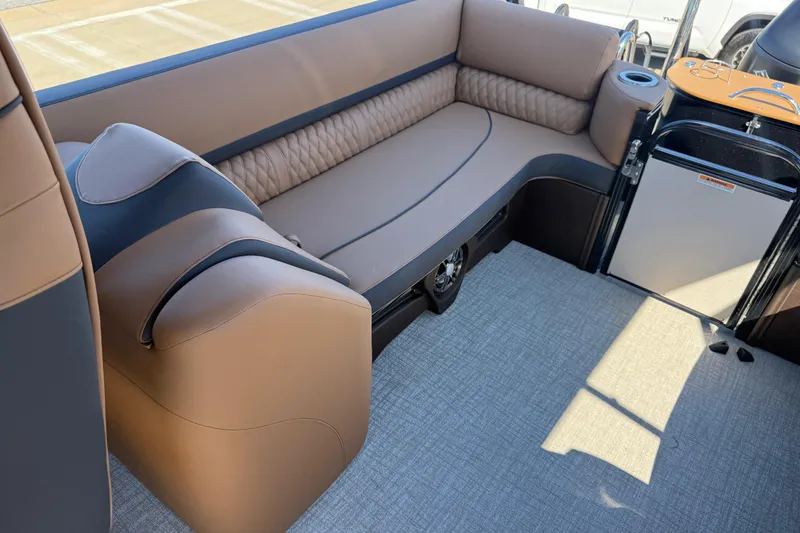 Slide: The Image of Luxurious seating in 2026 Avalon Catalina Quad Lounge boat, featuring elegant brown upholstery. - 31