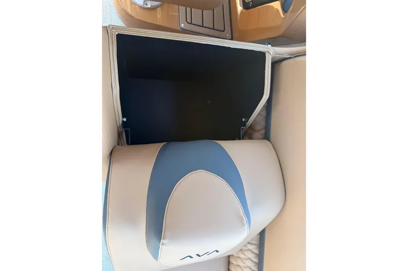 Slide: The Image of 2026 Avalon Catalina Quad Lounge interior storage compartment with beige and blue upholstery. - 33