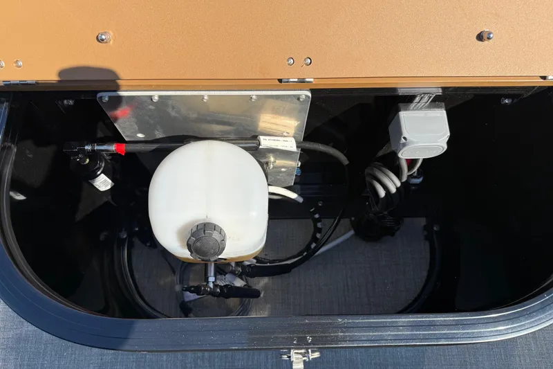 Slide: The Image of Storage compartment of 2026 Avalon Catalina Quad Lounge boat, featuring utility components and wiring. - 41
