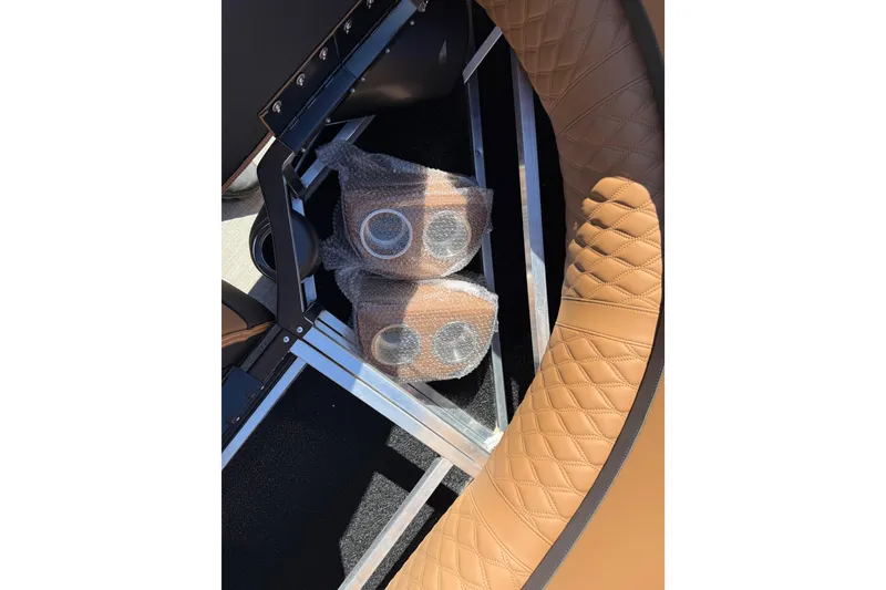 Slide: The Image of 2026 Avalon Catalina Quad Lounge interior with wrapped speakers and quilted tan seating. - 48