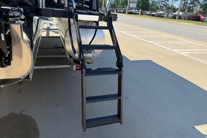 Slide: The Image of Rear view of 2026 Avalon Catalina Quad Lounge boat with boarding ladder. - 6