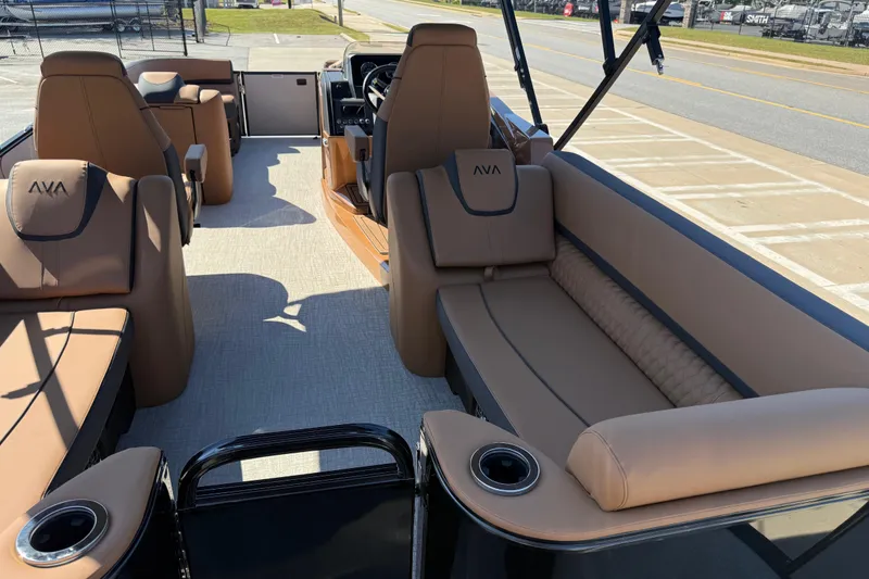 Slide: The Image of 2026 Avalon Catalina Quad Lounge boat interior with tan seating and modern design. - 60