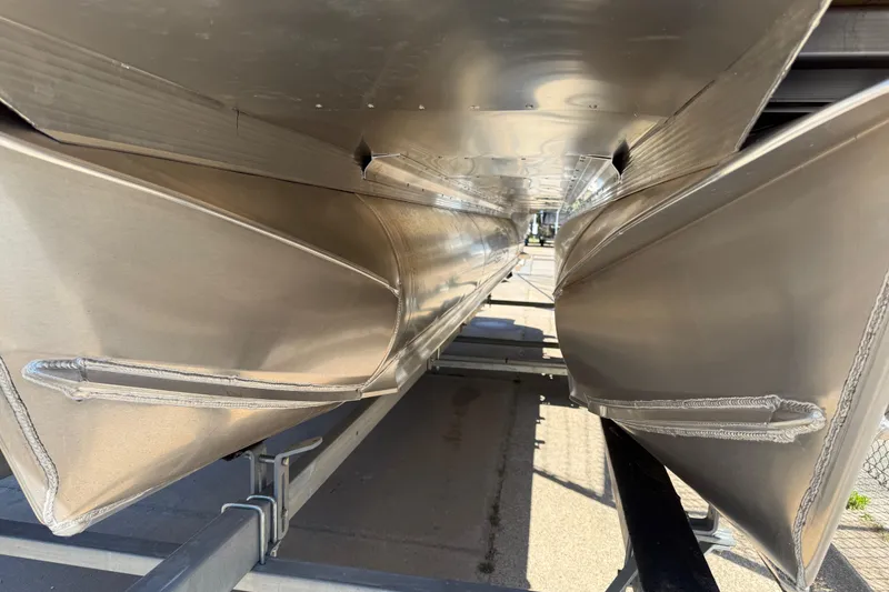 Slide: The Image of Underneath view of 2026 Avalon Catalina Quad Lounge pontoon boat on trailer. - 65