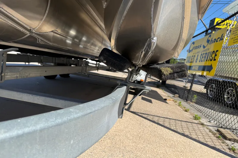 Slide: The Image of 2026 Avalon Catalina Quad Lounge boat on trailer at sales and service center. - 66