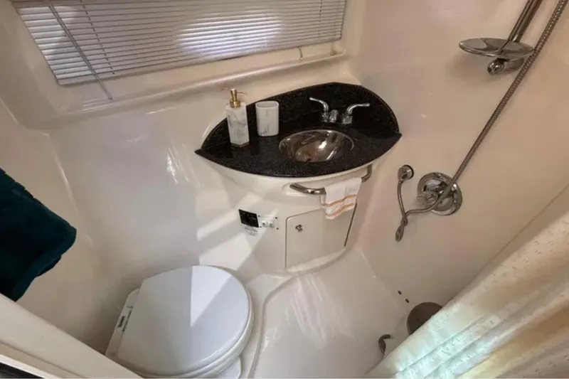 Slide: The Image of Bathroom interior of 2007 Chaparral Signature 350 yacht with sink, toilet, and shower. - 10
